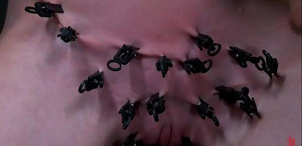 Gagged clamped sub on device bondage